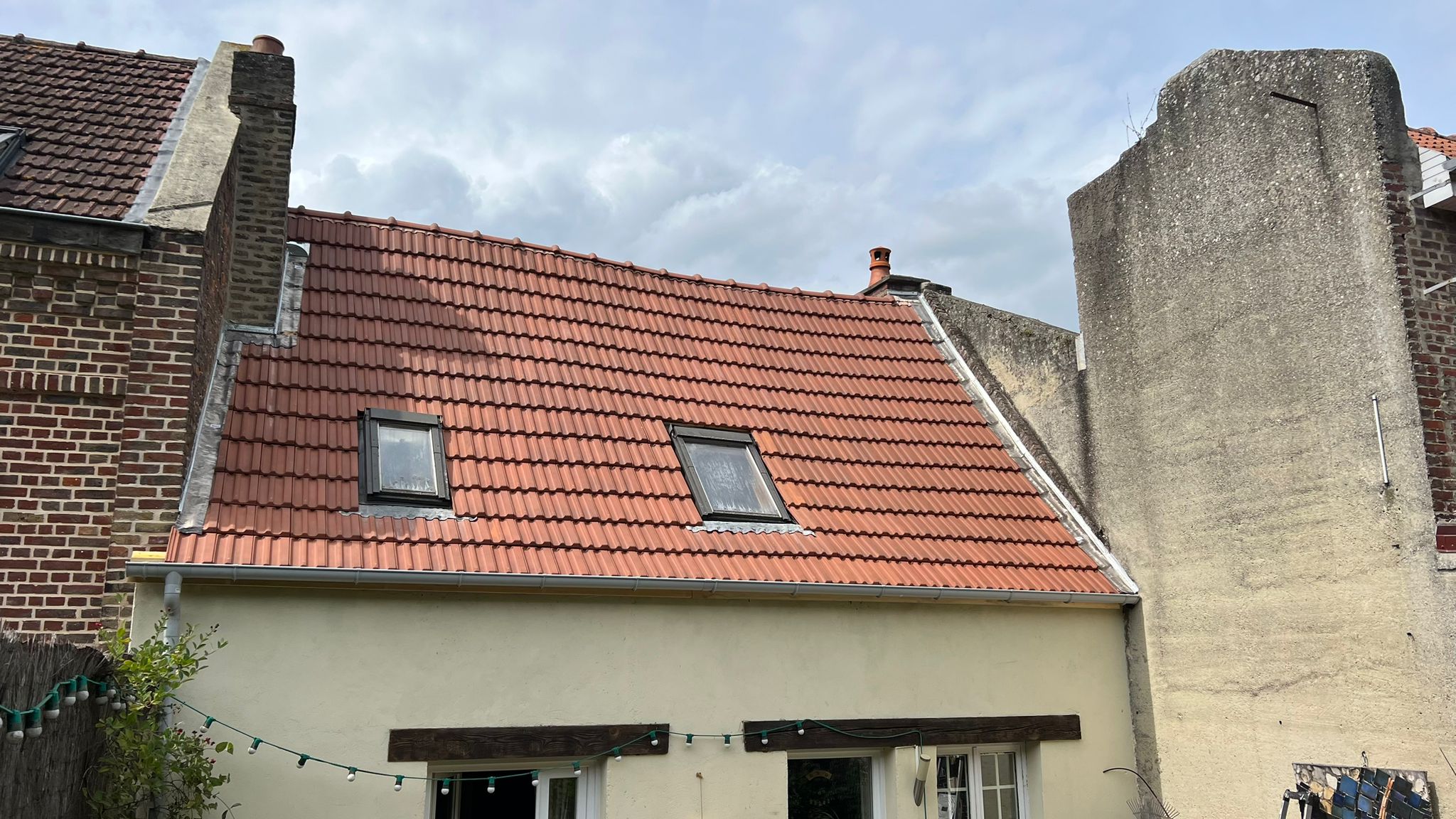 Intervention sur une toiture avec fenêtre de toit